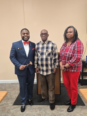 Anthony McGleen and two other people at his reappointment as Comissioner.