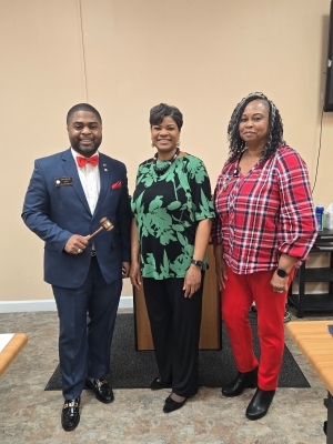 Brooketah Banks and two others at her reappointment as Comissioner.