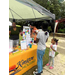 A small group of people at the Kinston Housing table getting prizes.