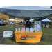 KHA sign next to their table at the National Night Out with a lady behind it.