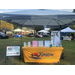 A table outside with information about Kinston Housing on it.